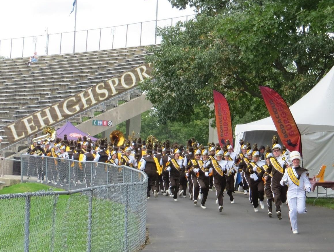 The Marching 97 running from one end of the stadium to the other during the psyche run