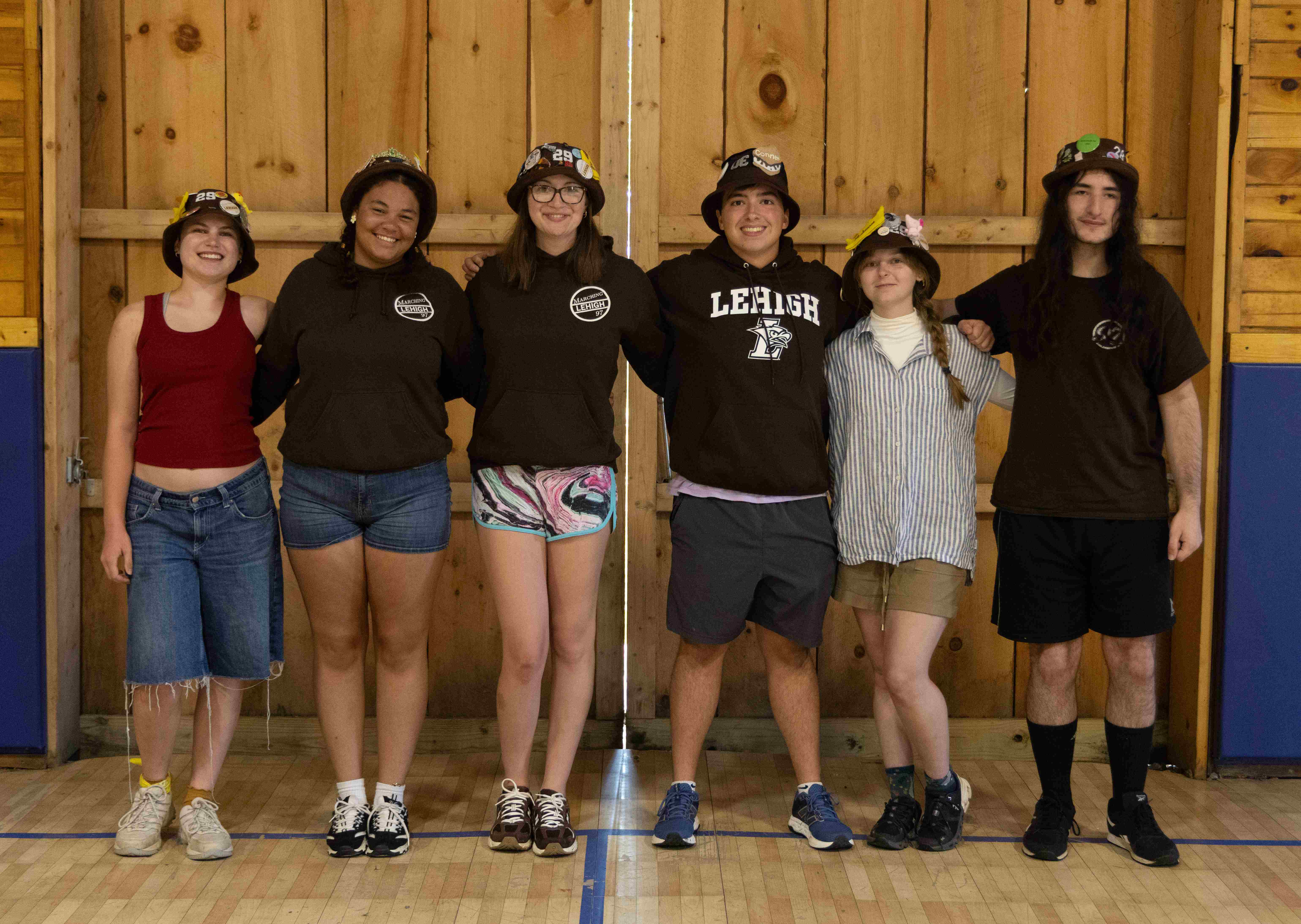 Rank 10 smiling with their arms around each other at band camp.