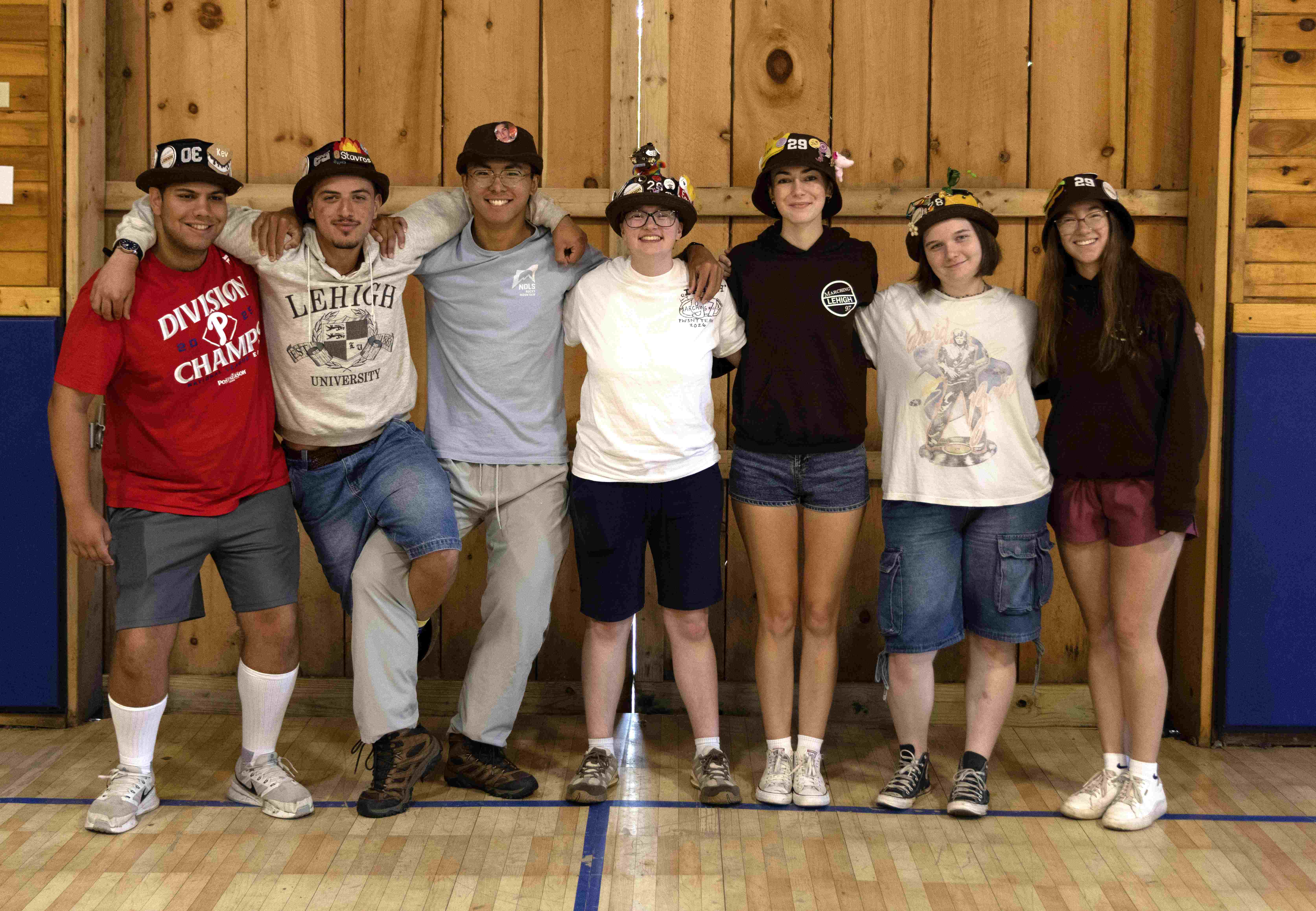 Rank 13 smiling with their arms around each other at band camp.