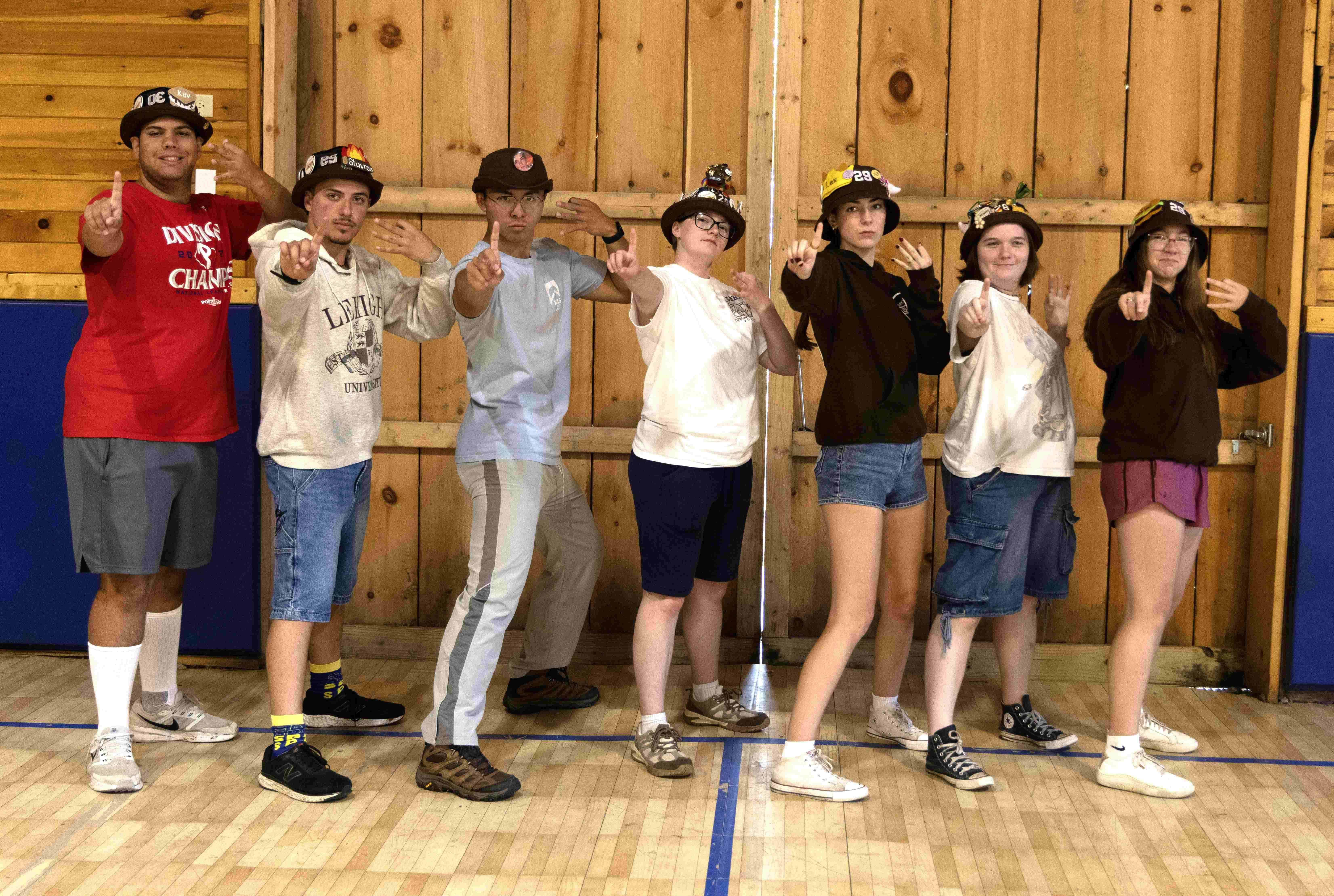 Rank 13 pretending to shoot an arrow, with one finger up and three fingers pulled back.