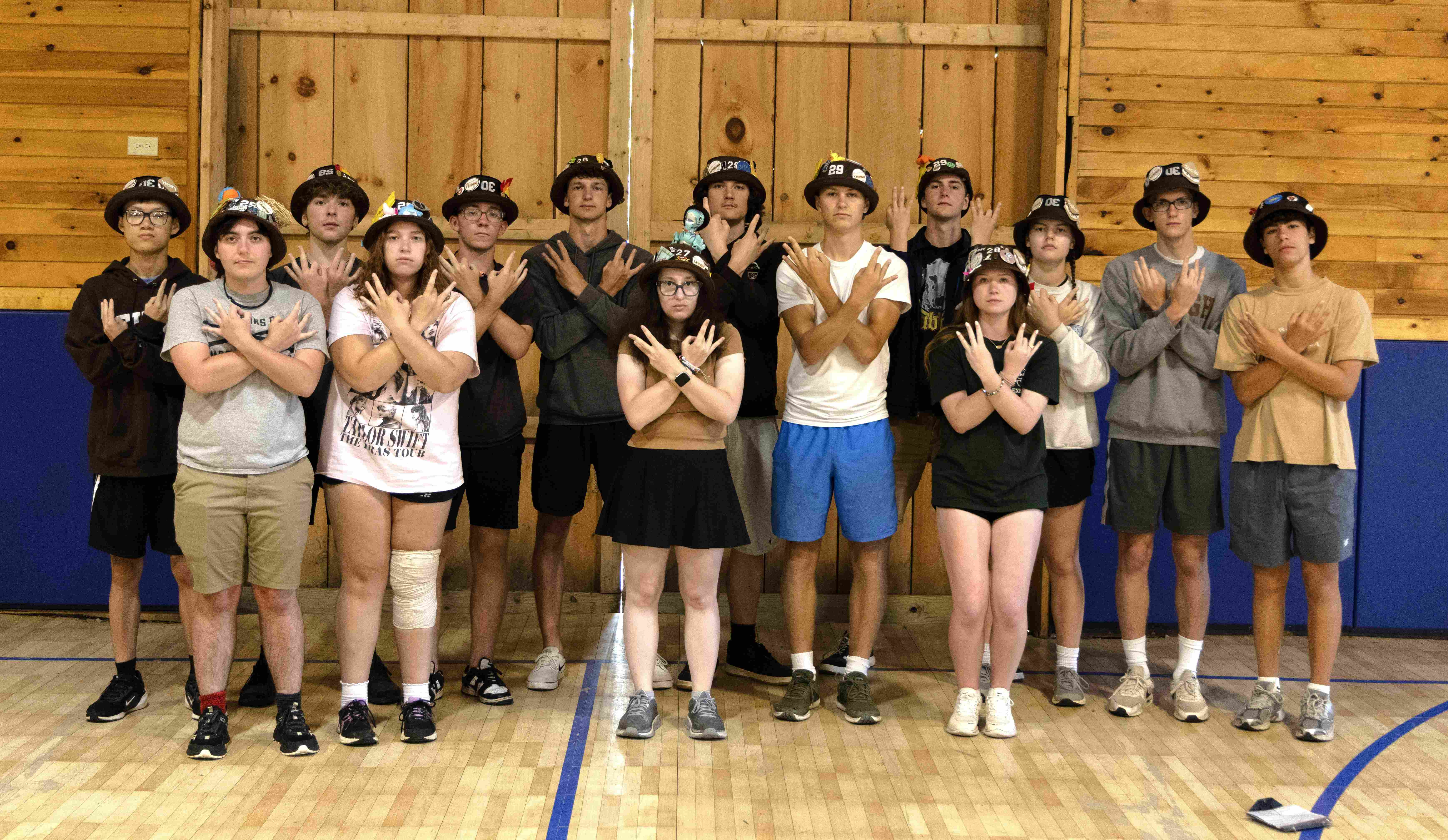 Ranks 3 and 12 in three rows holding up three fingers on one hand and one and then two fingers on the other.